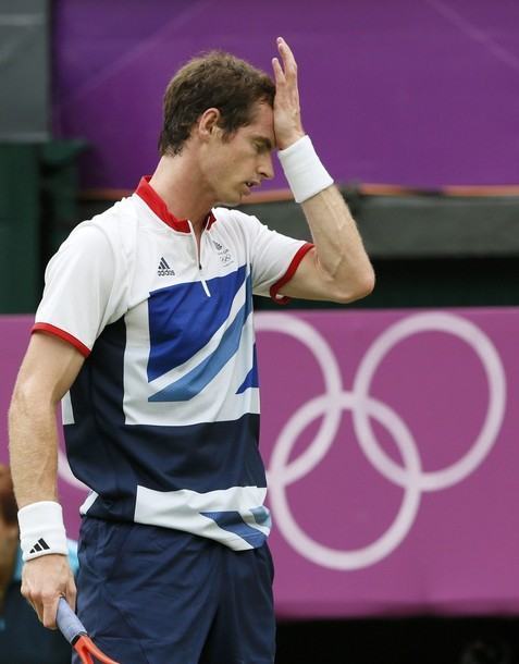 Great Britain's Andy Murray reacts during his men's singles tennis match against Switzerland's Stanislas Wawrinka at the All England Lawn Tennis Club during the London 2012 Olympics Games July 29, 2012.    REUTERS/Stefan Wermuth (BRITAIN  - Tags: OLYMPICS SPORT TENNIS)