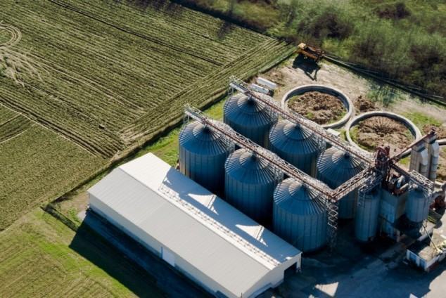 Tower silos and storage facility, aerial view
