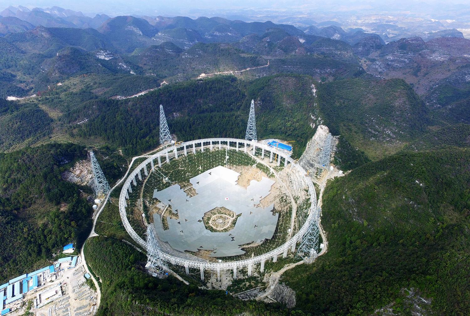 PINGTANG, CHINA - NOVEMBER 26: (CHINA OUT) The feed supporting system of the five-hundred-metre Aperture Spherical Radio Telescope (FAST) is under test on November 26, 2015 in Pingtang County, China. The construction will be completed in September 2016. (Photo by ChinaFotoPress/ChinaFotoPress via Getty Images)