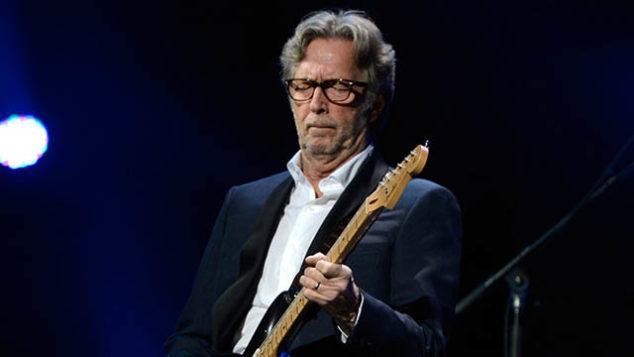 NEW YORK, NY - DECEMBER 12:  Eric Clapton performs at "12-12-12" a concert benefiting The Robin Hood Relief Fund to aid the victims of Hurricane Sandy presented by Clear Channel Media & Entertainment, The Madison Square Garden Company and The Weinstein Company at Madison Square Garden on December 12, 2012 in New York City.  (Photo by Kevin Mazur/WireImage for Clear Channel)