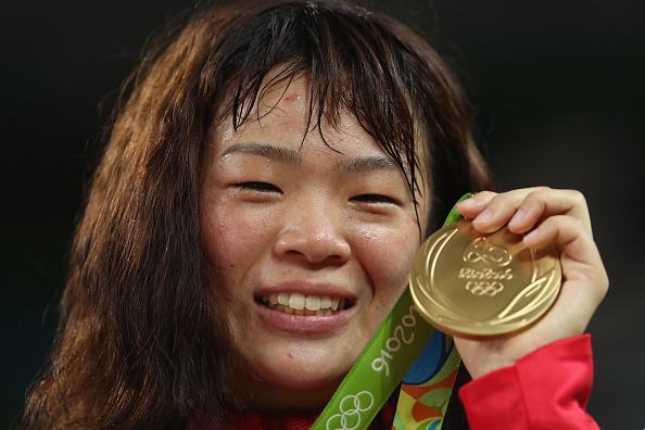 RIO DE JANEIRO, BRAZIL - AUGUST 18: Gold medalist Risako Kawai of Japan celebrates during the medal ceremony following the Women's Freestyle 63 kg competition on Day 13 of the Rio 2016 Olympic Games at Carioca Arena 2 on August 18, 2016 in Rio de Janeiro, Brazil. (Photo by Julian Finney/Getty Images)