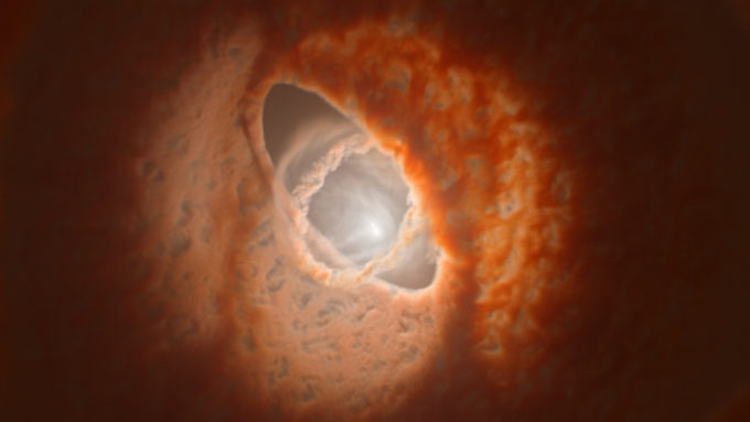 Representação artística do sistema ternário GW Orionis, com o vácuo entre os discos de acreção em evidência (Crédito: ALMA [ESO/NAOJ/NRAO], ESO/Exeter/Kraus et al.)